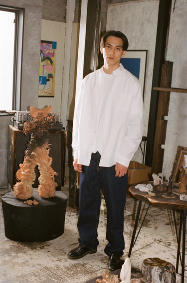 Takeshi wearing vowels shirting and denim